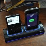 A full-sized iPod and an iPhone 3G charging. Notice the illumination is turned on.