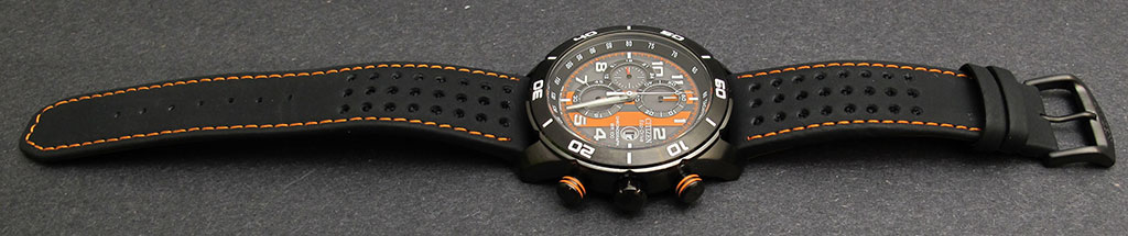 ... metal buckle. Orange stitches pair with the orange watch face details