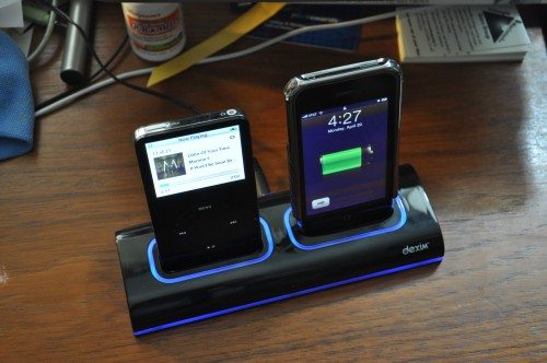 A full-sized iPod and an iPhone 3G charging. Notice the illumination is turned on.