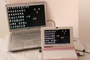 This is my Dell laptop which is the activated desktop and my Acer netbook with the Secure Key showing the identical desktop.  Whatever pretty picture you have as wallpaper will go to black when you remote access your desktop.