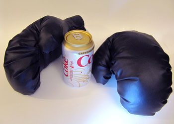 Boxing gloves -- pop can used for scale