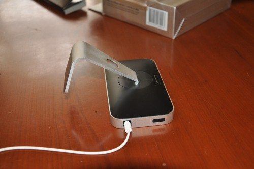 Facedown on the table, you can see the swivel of the base, as well as the iPhone release button.