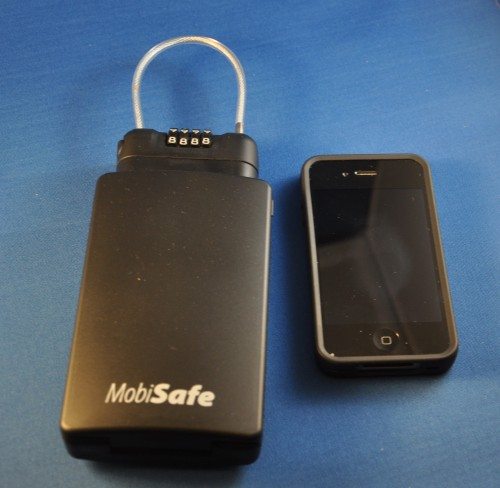 MobiSafe next to an iPhone 4 for size comparison.