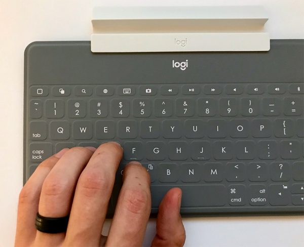 Keys-To-Go Keyboard with hand on it