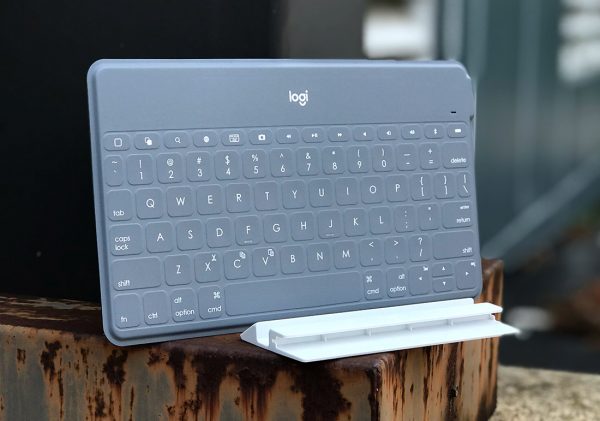 Logitech KEYS-TO-GO bluetooth keyboard leaning next to metal pole