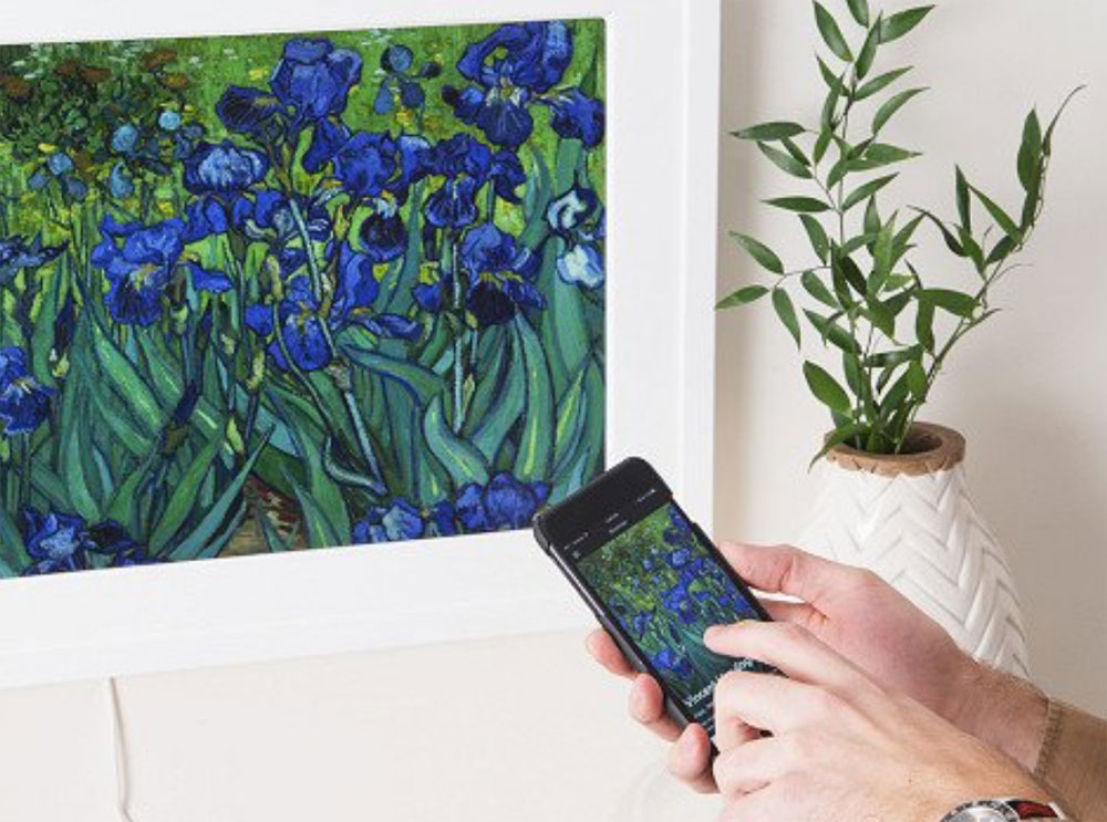 Change the art on your wall with a wave of your hand with this digital
