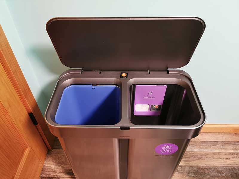 Simple human dual compartment trash bin.