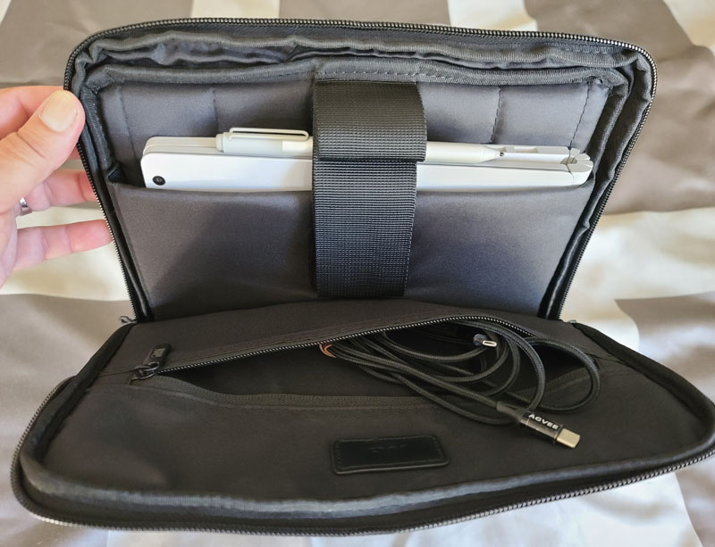 July Carry-On Pro review - a roll aboard suitcase, laptop sleeve, and