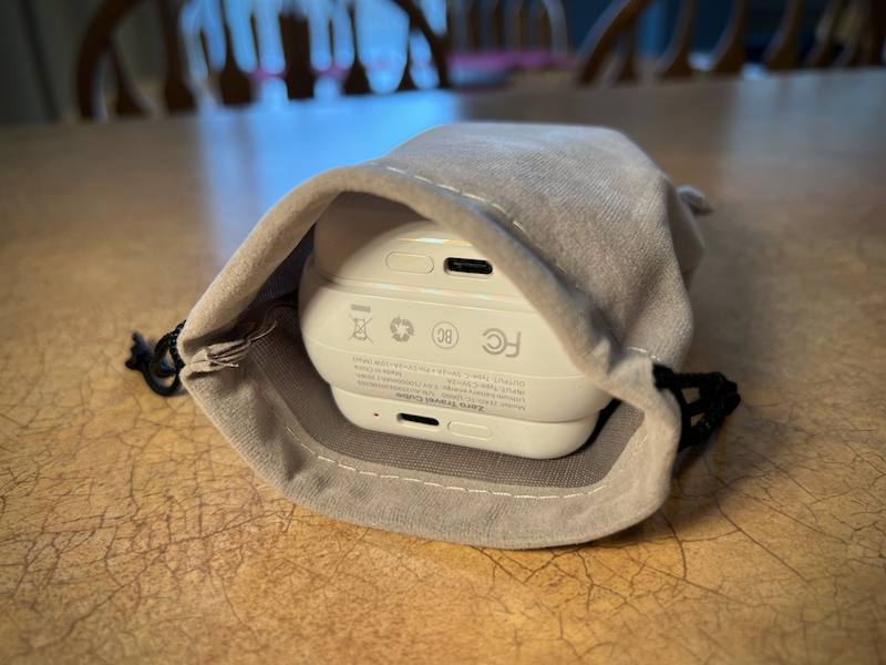 The pouch included with the Travel Cube can hold it and two Wireless Qi Pads with room left over for cables