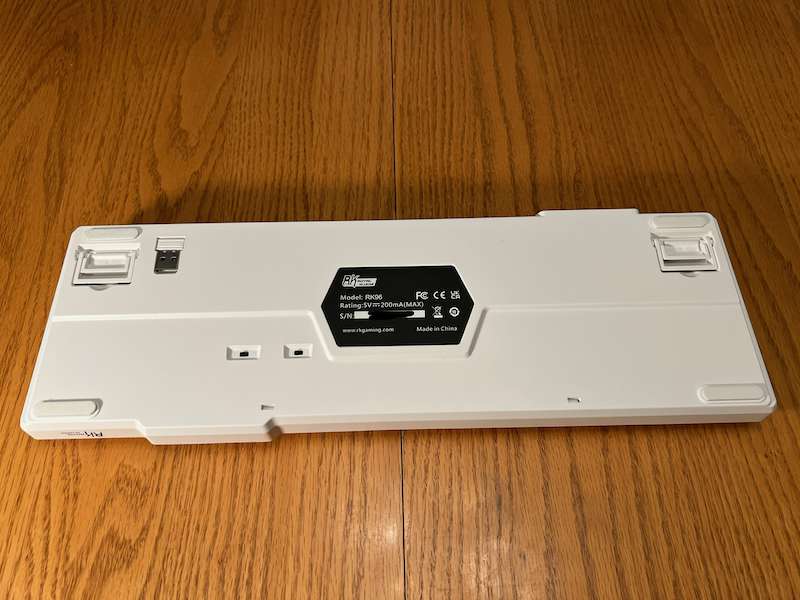 Royal Kludge RK96 underside showing switches, feet, and 2.4 GHz receiver
