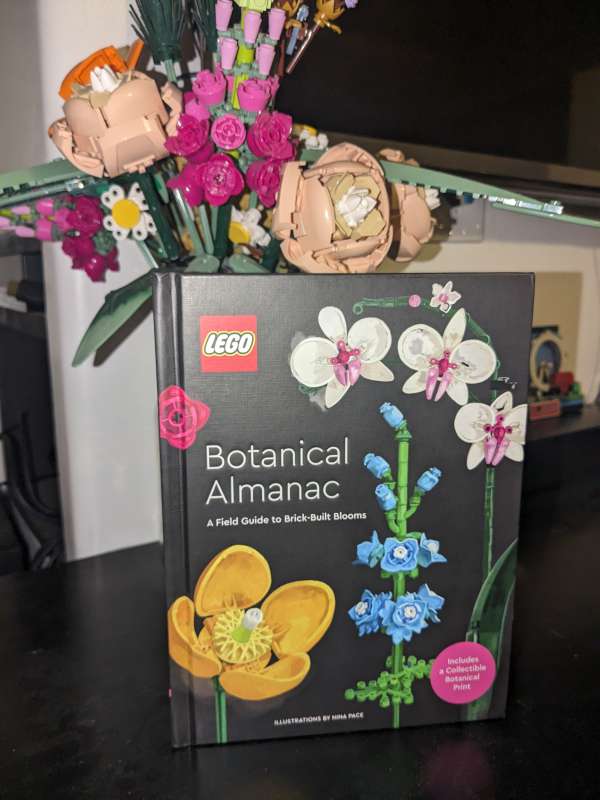 LEGO Botanical Almanac with LEGO bouquet behind it