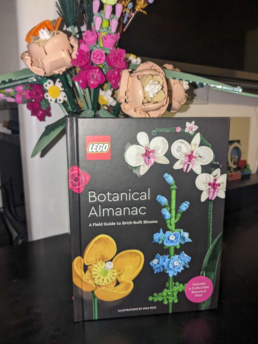 LEGO Botanical Almanac with LEGO bouquet behind it