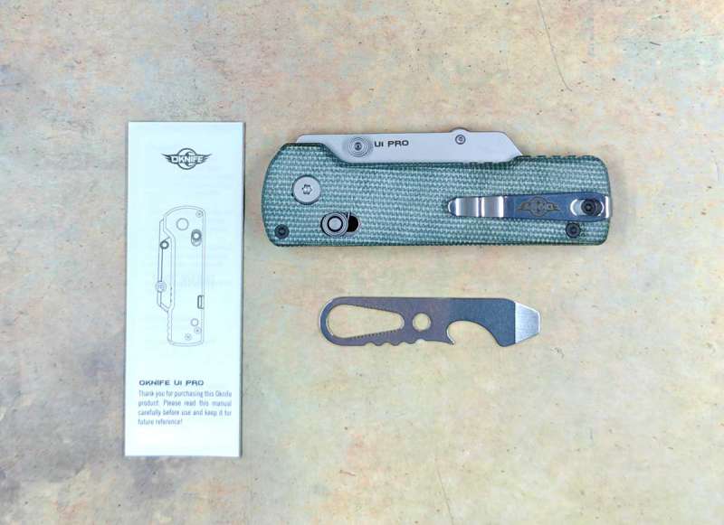 a pocket knife with a small knife cutter