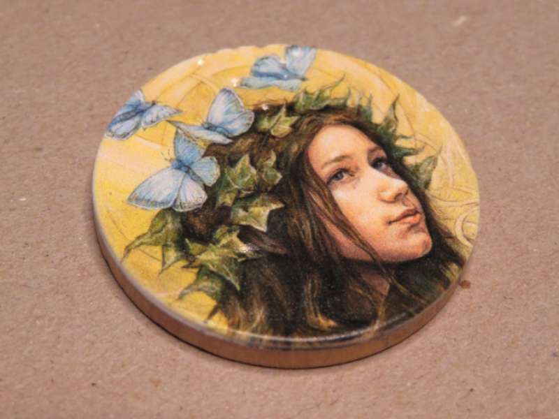 The imperfections in the wood are visible through half a millimeter of white resin.