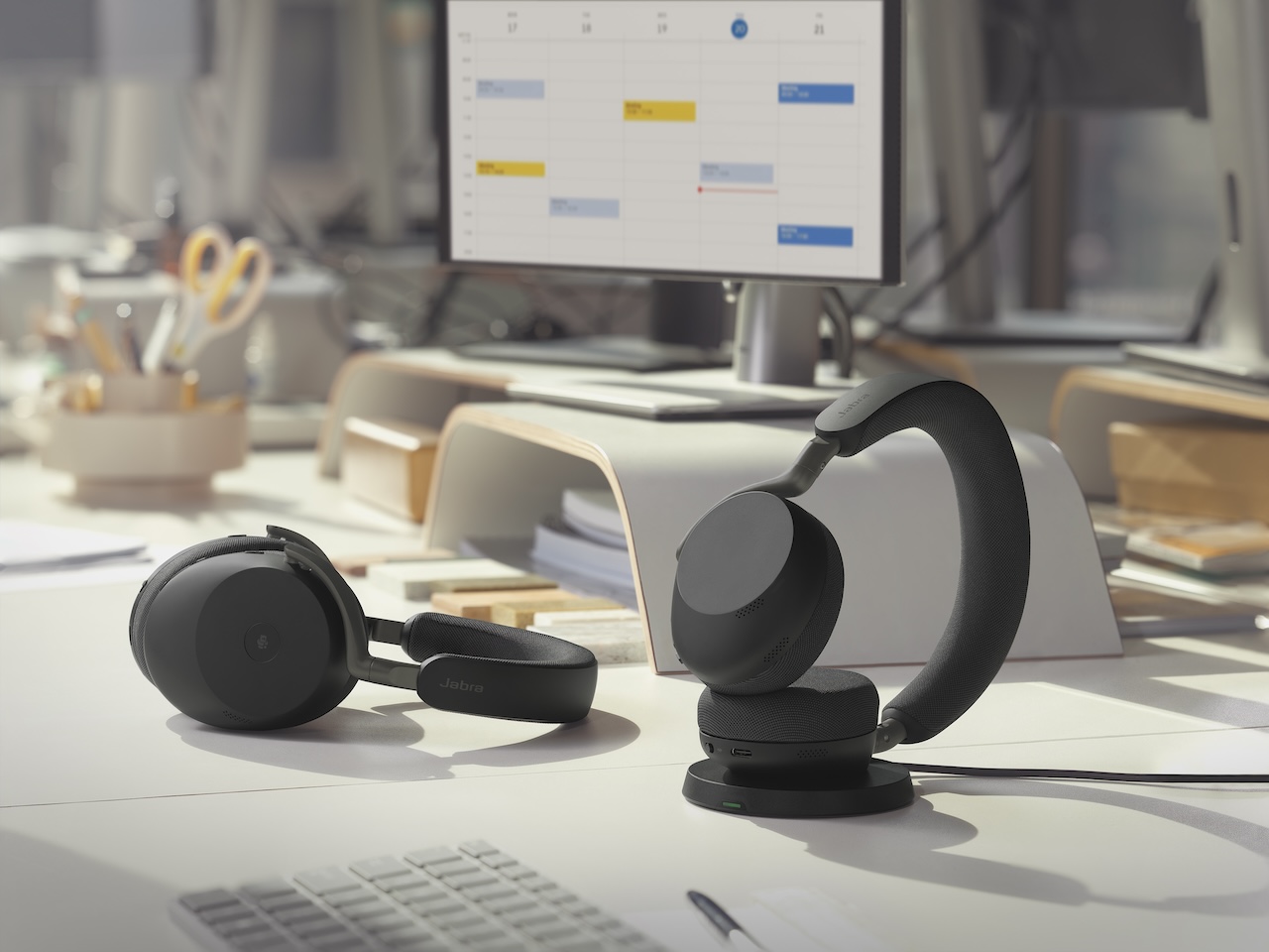 Jabra Evolve3 85 MS Lying and Evovle3 75 UC Charging Office Desk Medium