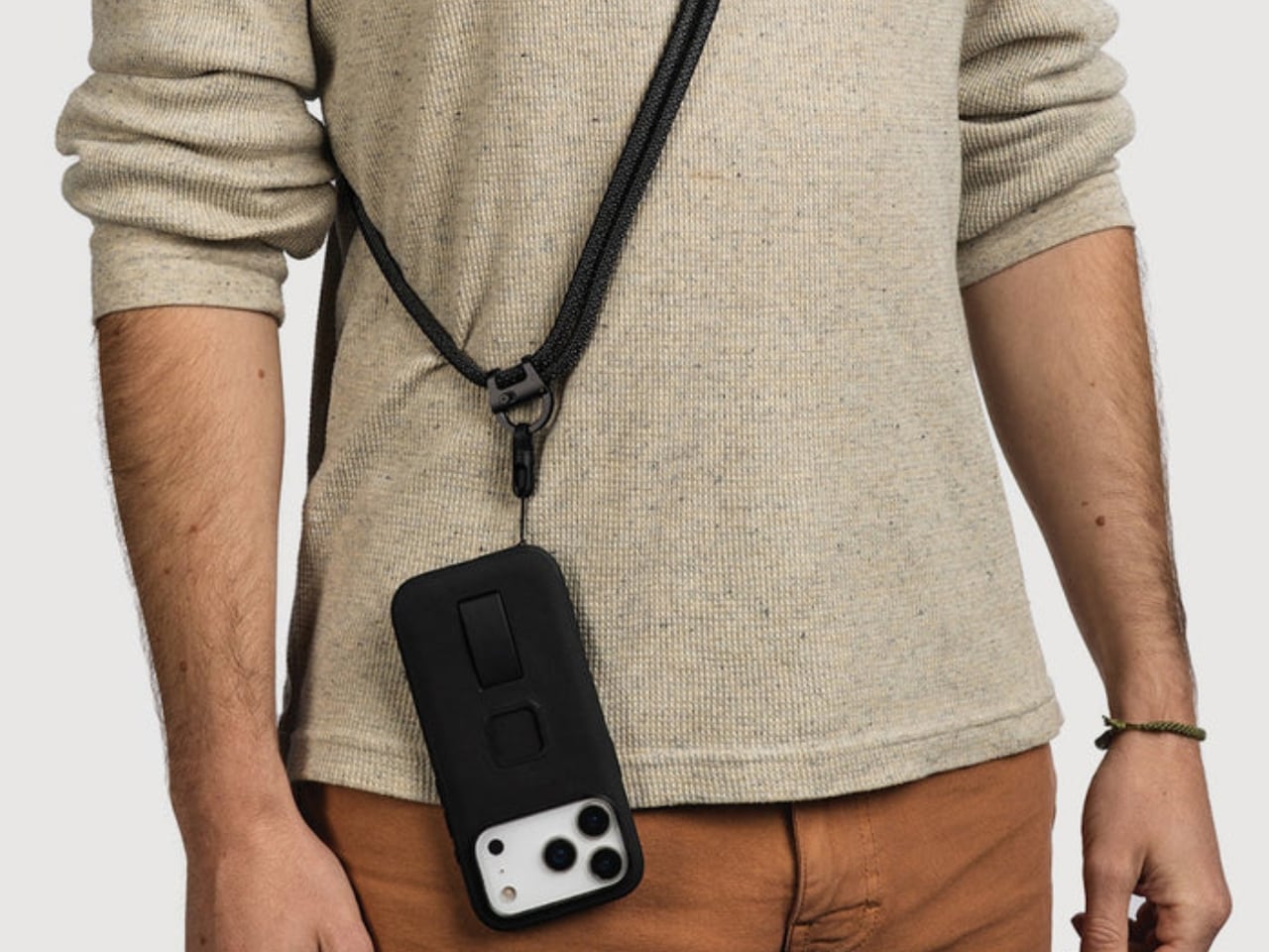 Peak Design Mobile Cuff, Crossbody Strap, and Crossbody Multi-Strap laid out with Micro Anchor connectors visible, showing CNC machined aluminum hardware and custom woven cords