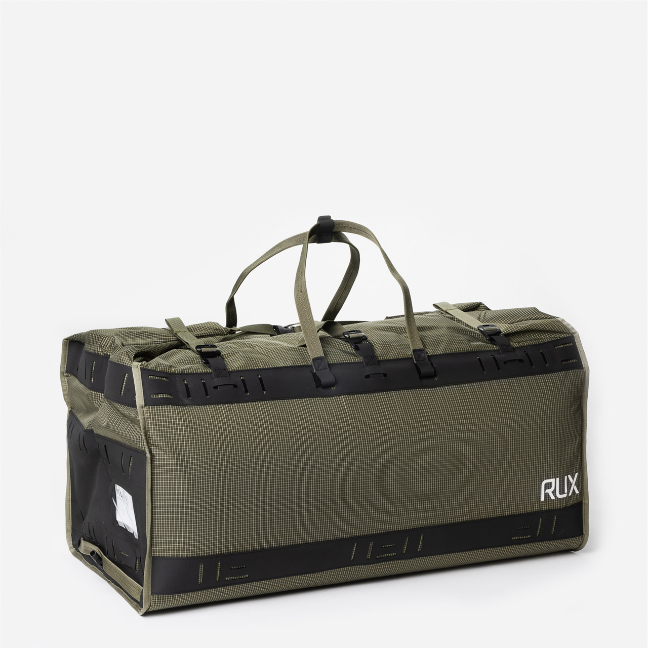 RUX Duffel Box standing upright with the roll-top open, showing gear organized inside