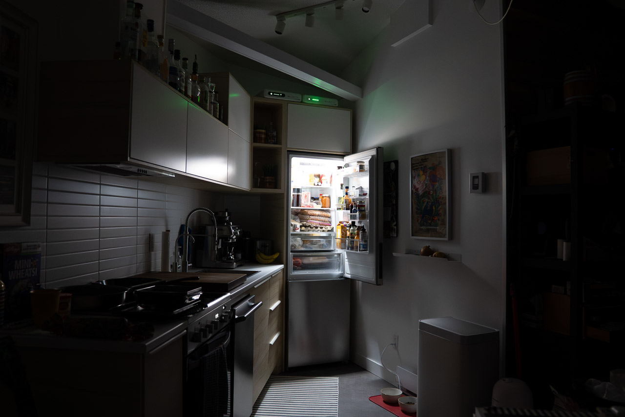 BLUETTI FridgePower supplying backup power to a refrigerator in a compact kitchen during a power outage