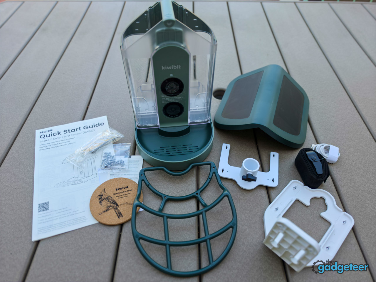 Kiwibit Bird Feeder 2 box contents including feeder, pole mount, wall mount, tree strap, and USB-C cable
