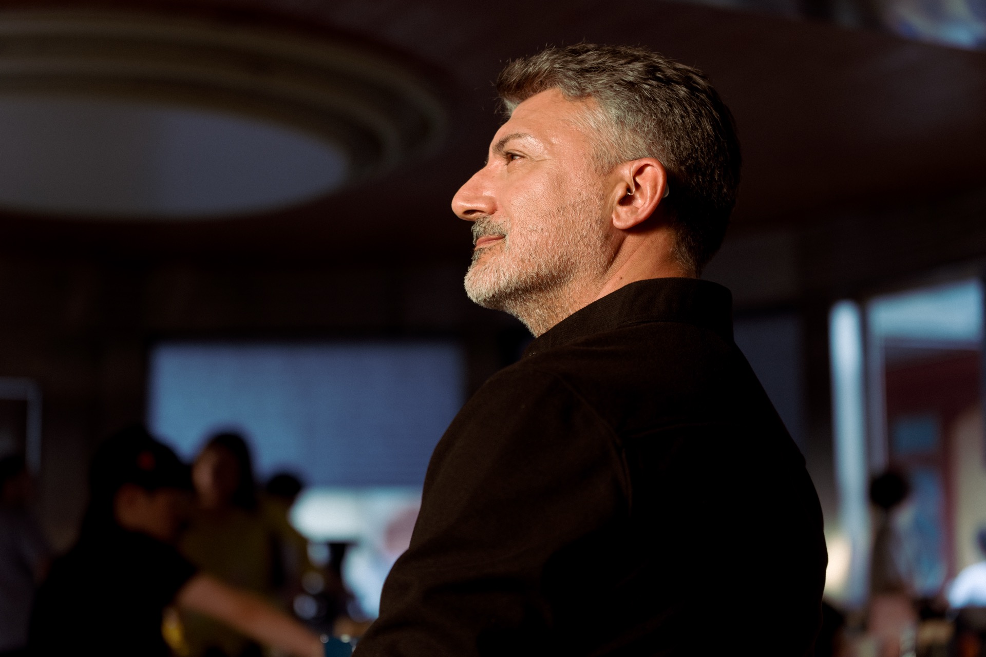 A Beyond 2 Pro wearer seated in an auditorium.