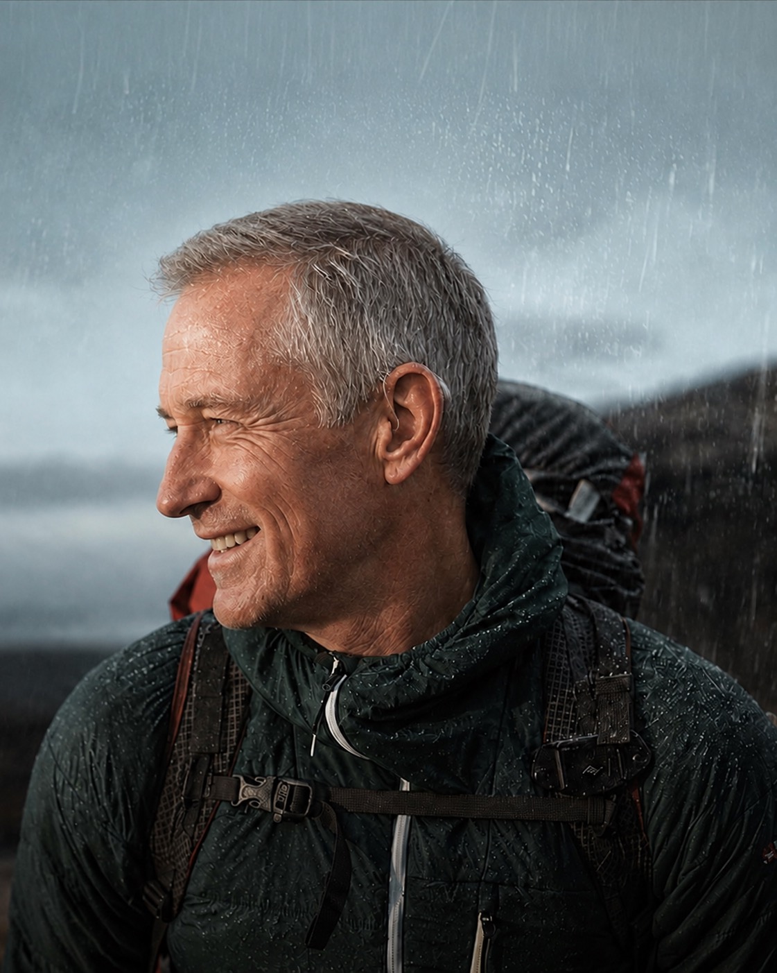 A hearing aid wearer outdoors in rain.
