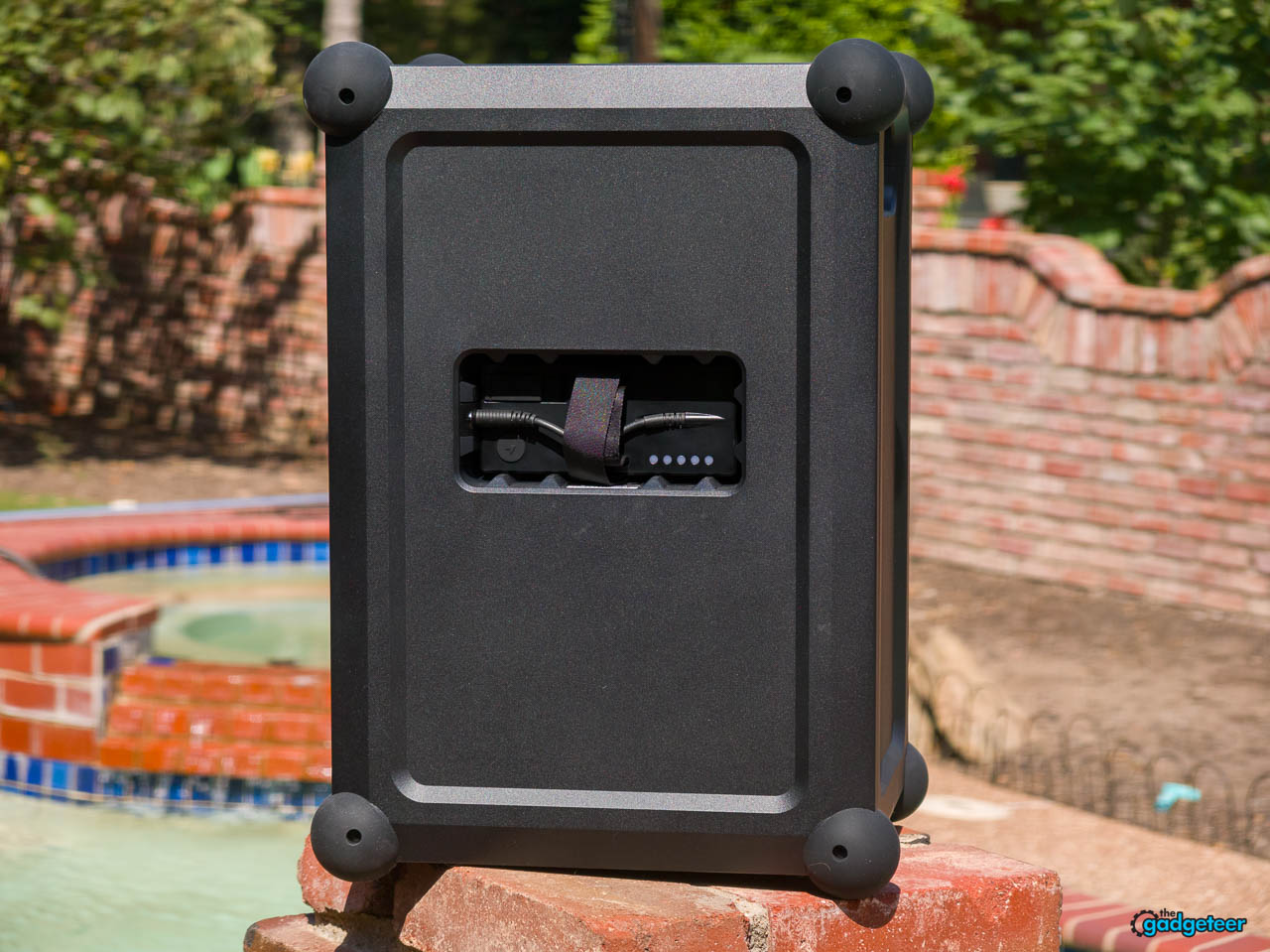 SOUNDBOKS Mix at a poolside patio showing its front and control panel