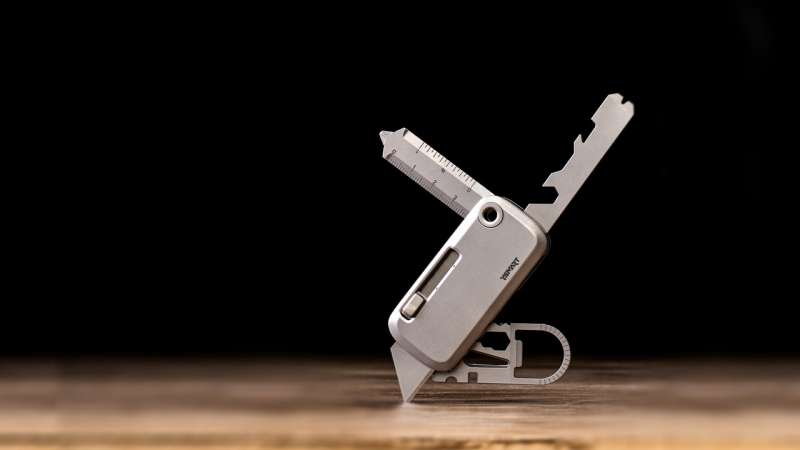 YSMART TOOLT utility tool opened on a wooden work surface