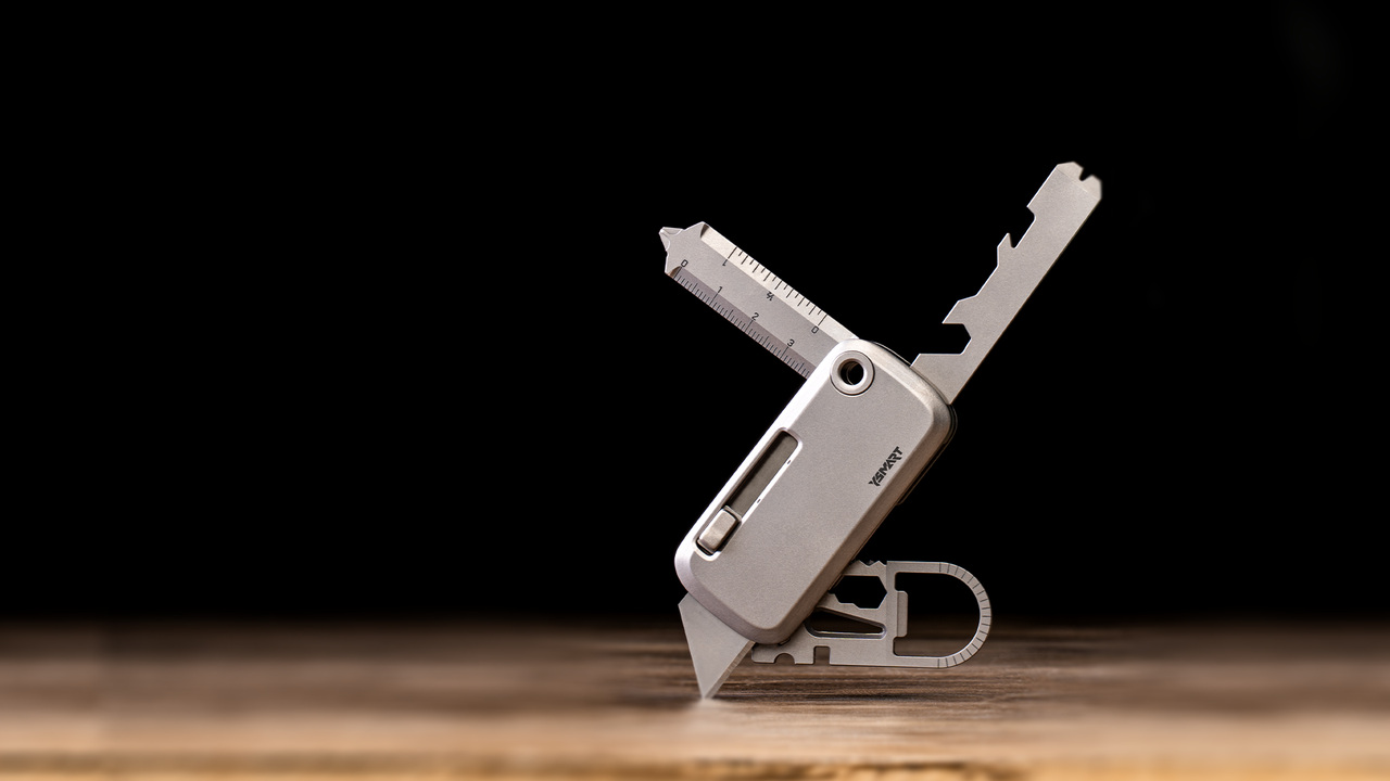 YSMART TOOLT utility tool opened on a wooden work surface