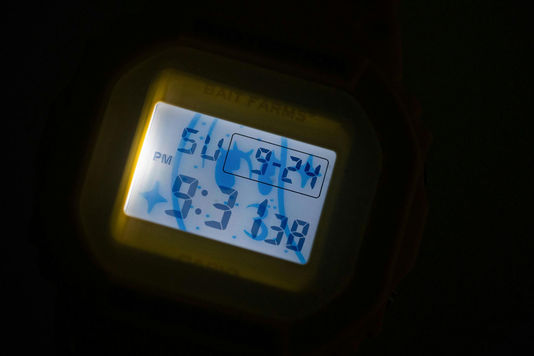 Illuminated DW5600 LCD showing the Shawty with Freckles banana mascot behind the time.