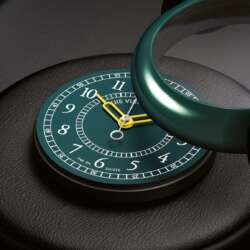 Green ceramic Louis Vuitton Monterey case being fitted over its green dial during assembly.