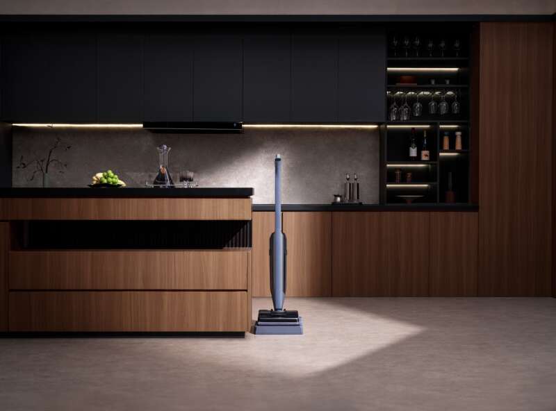 Narwal next flagship wet-dry vacuum in its dock in a dark kitchen