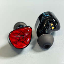 Noble FoKus Amadeus earbuds showing the red faceplate, black shell and silicone ear tip