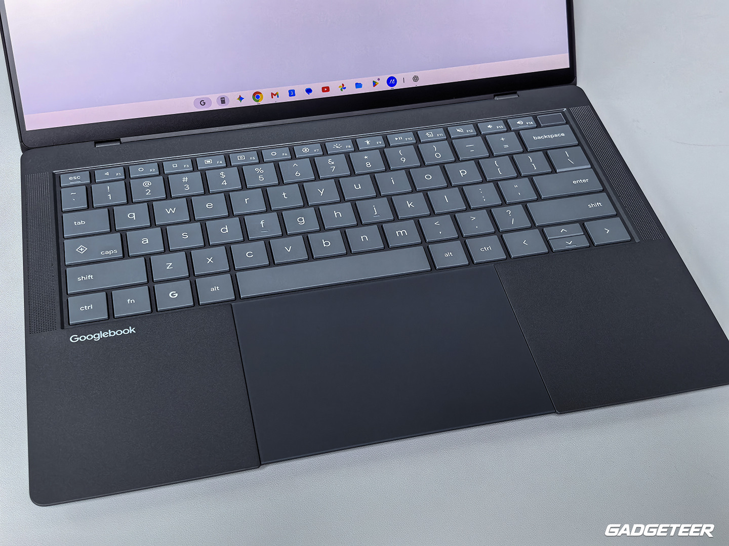The Googlebook 14 keyboard, with speaker grilles on both sides.