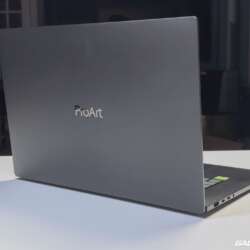 Rear view of the ASUS ProArt P16 showing its ProArt lid and right-side ports.