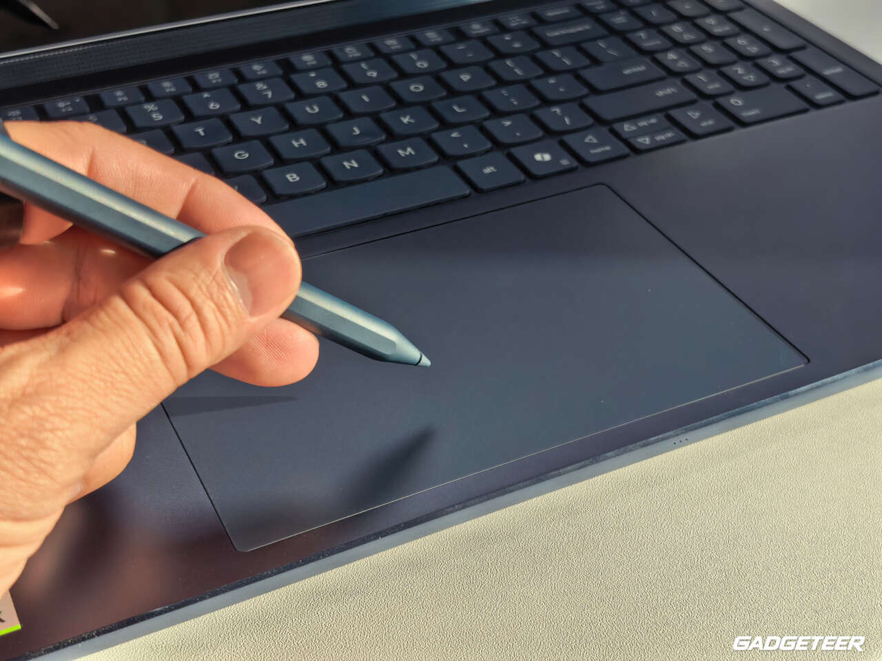 Yoga Pen held above the Lenovo Yoga 9n Force Pad