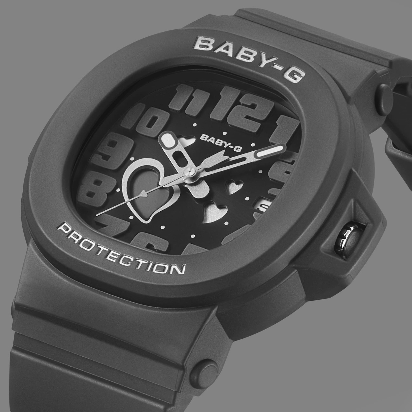 Close-up of the black BABY-G BGA-10 dial with raised numerals and heart-shaped openings