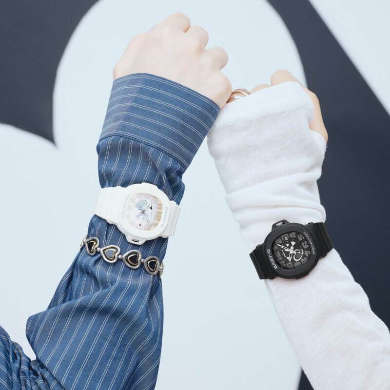 Black and white Casio BABY-G BGA-10 watches worn on two wrists