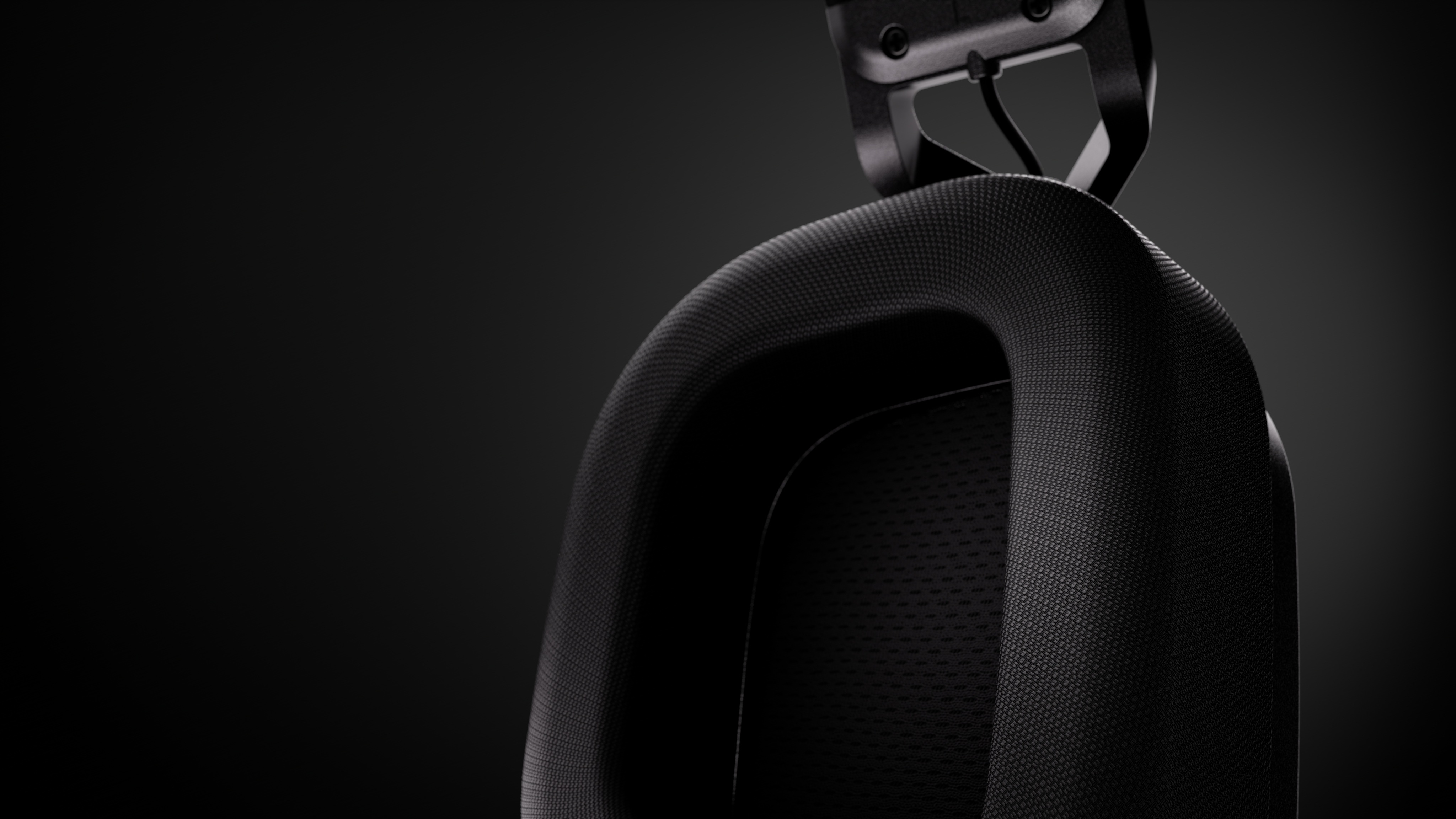 Fabric-covered memory foam cushions sit beneath the headset’s floating headband.