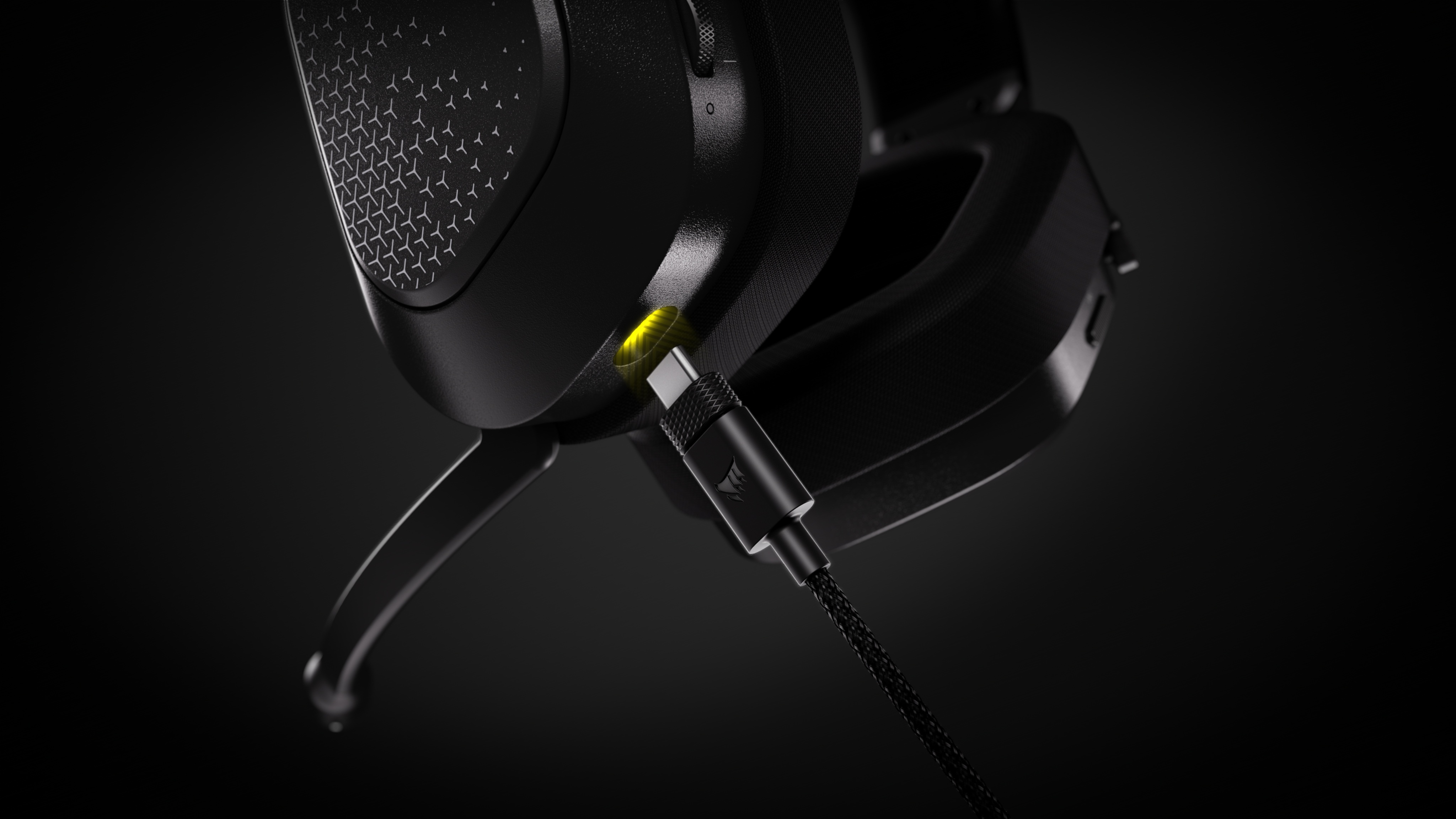 The headset charges over USB and can remain in wireless use while plugged in.