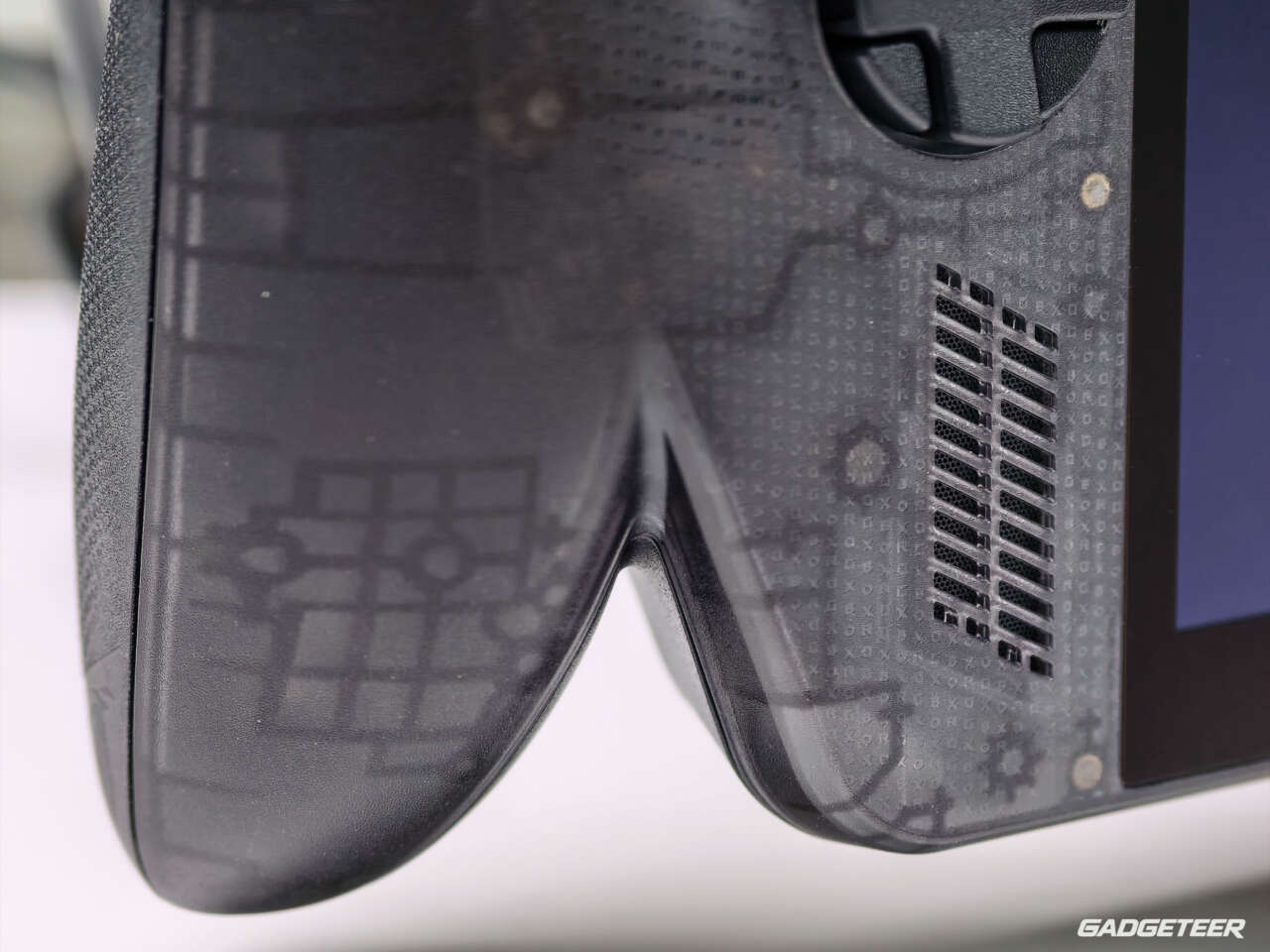 Close-up of the textured black grips and translucent front shell.
