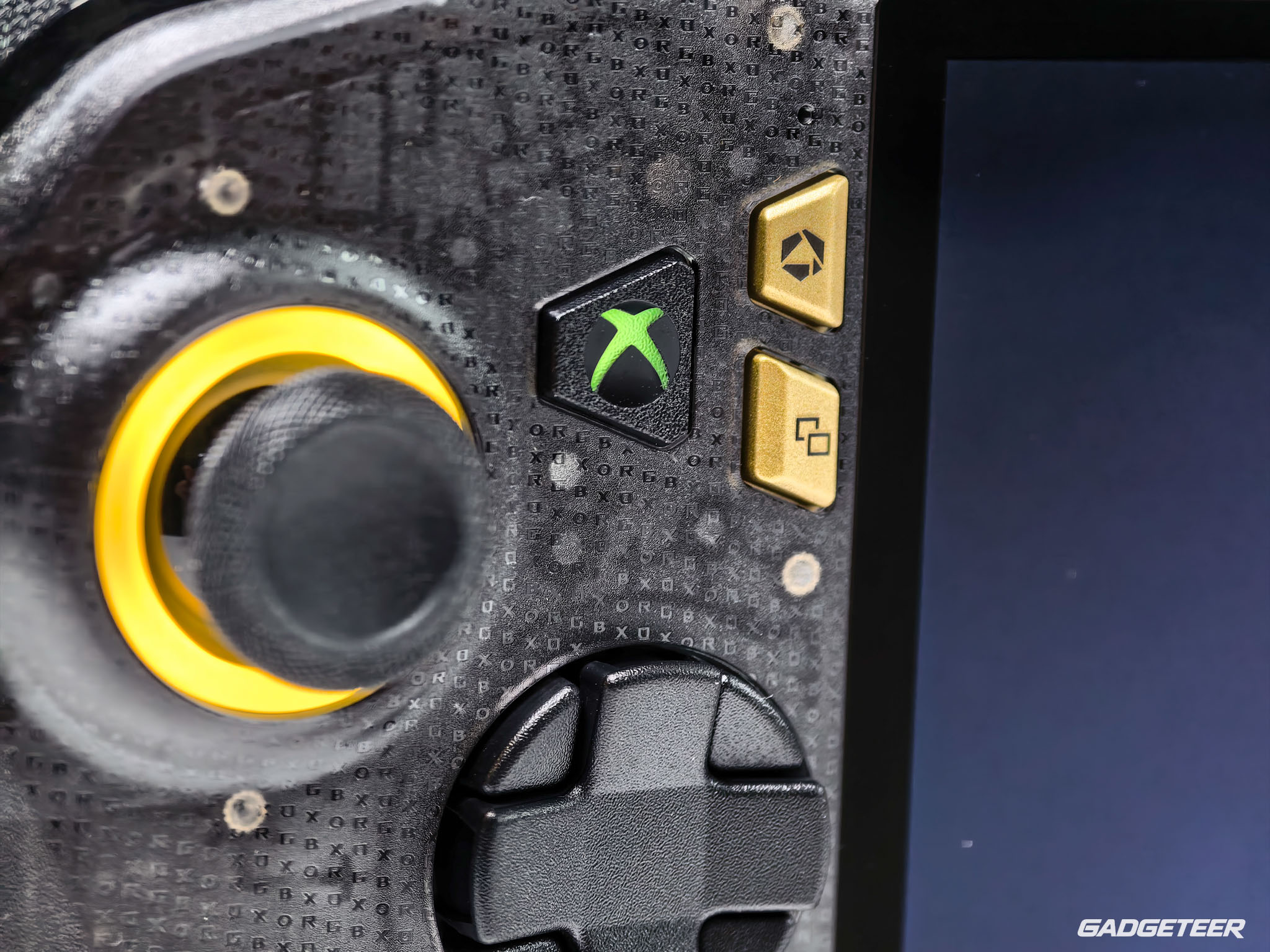 The left stick and transforming D-pad beside the textured shell.