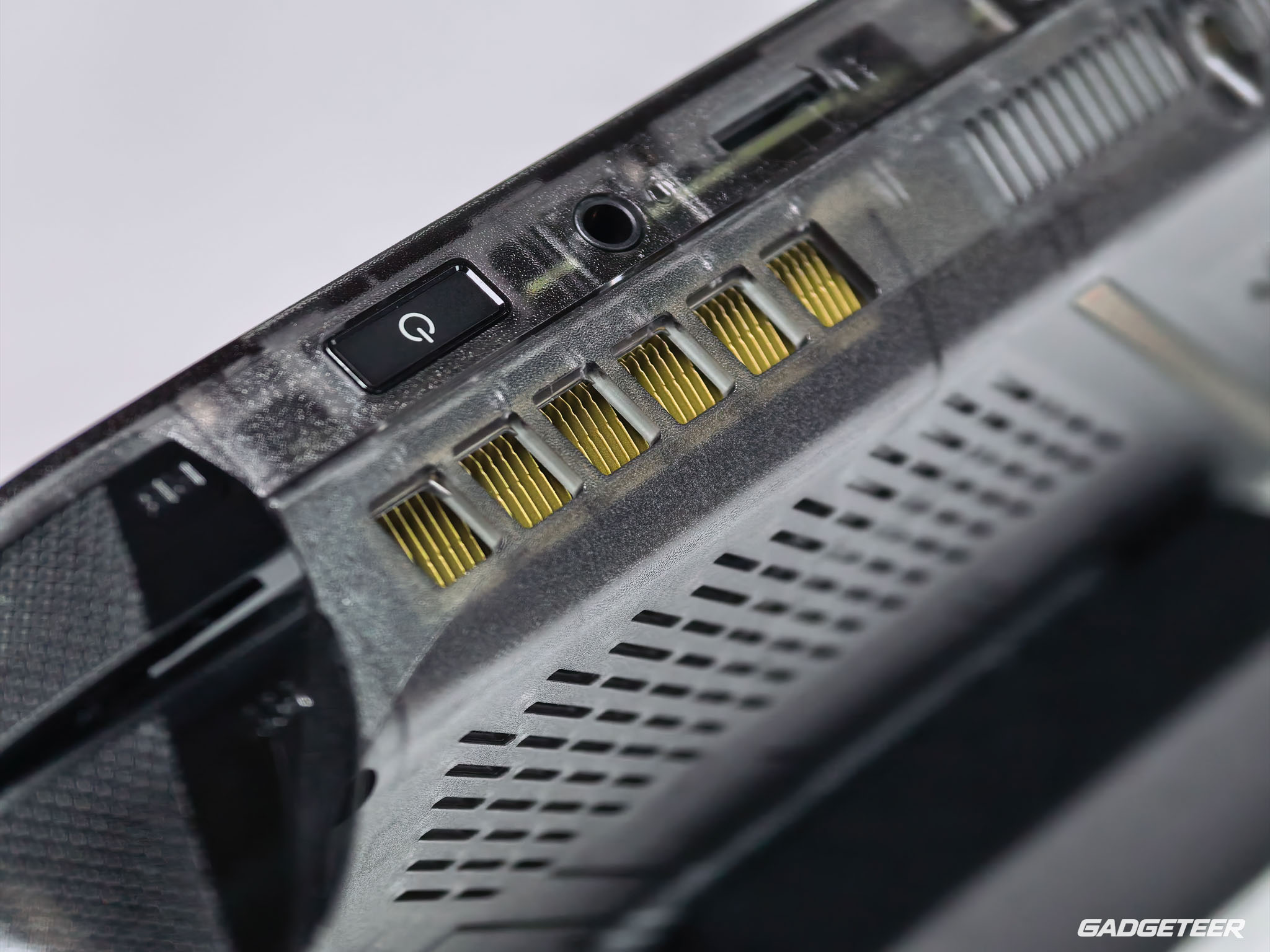USB-C ports, the audio jack and ventilation along the top edge.