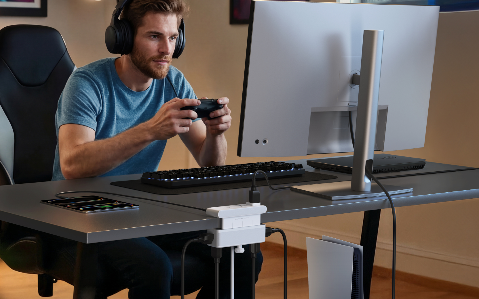 White Anker Nano A9196 clamped to a gaming desk with plugs above and below the surface