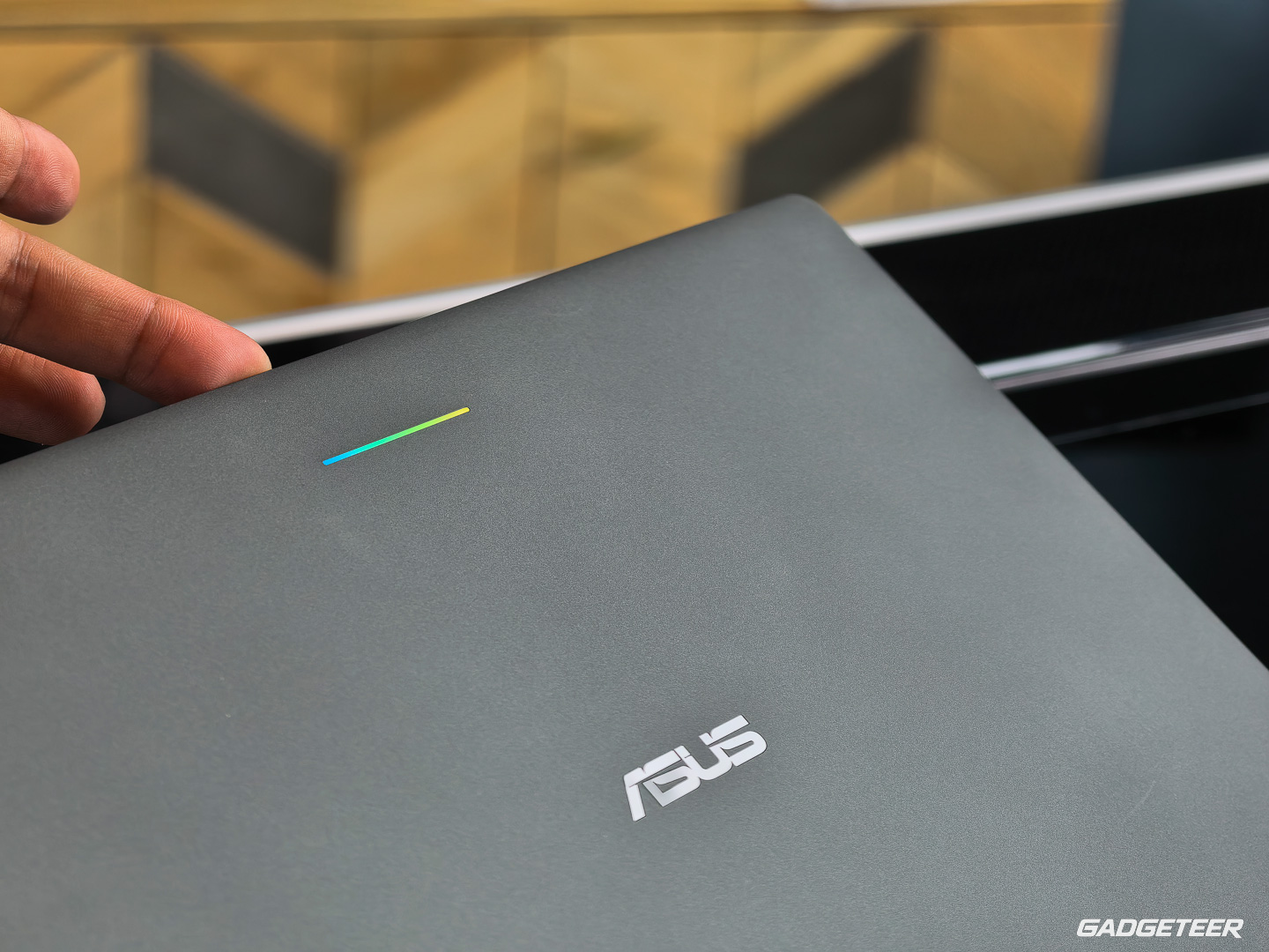 ASUS logo and multicolor light bar on the Googlebook 14 lid.