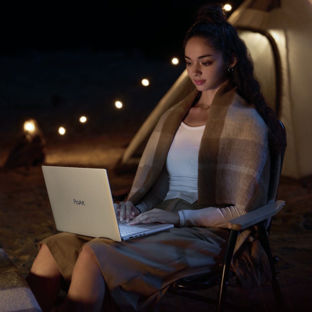ASUS-supplied photograph of the ProArt P14 used outdoors