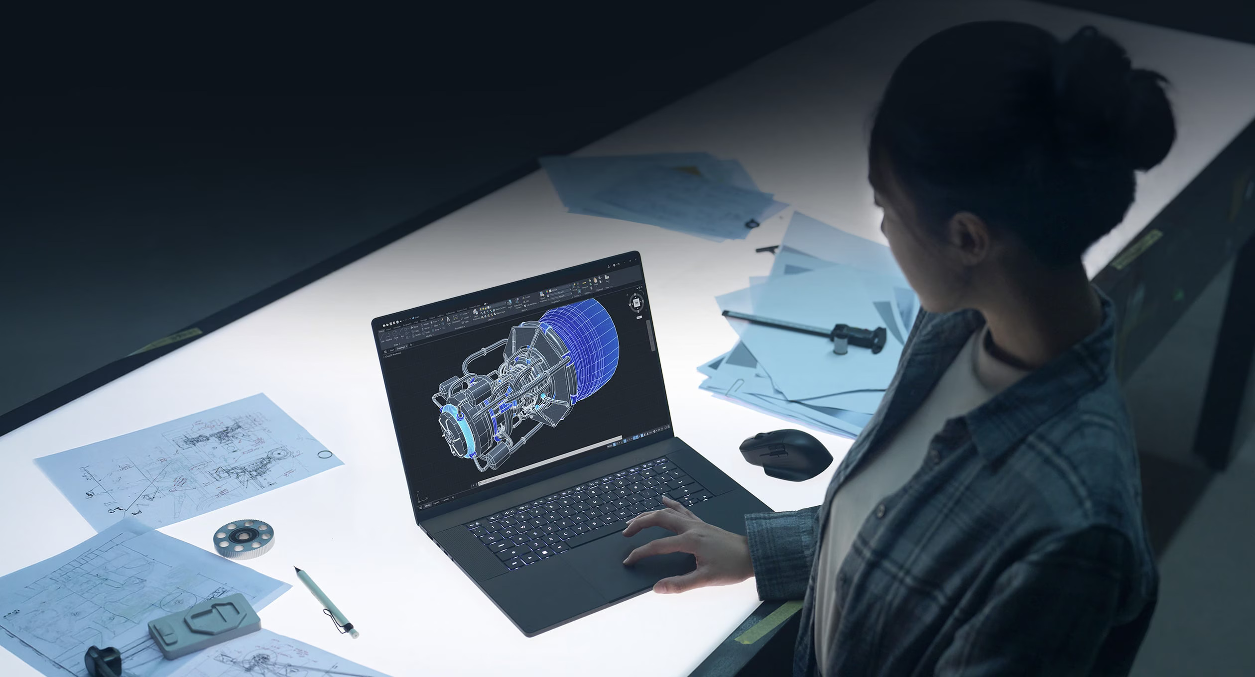ASUS ProArt P16 on a creator desk with CAD work on screen