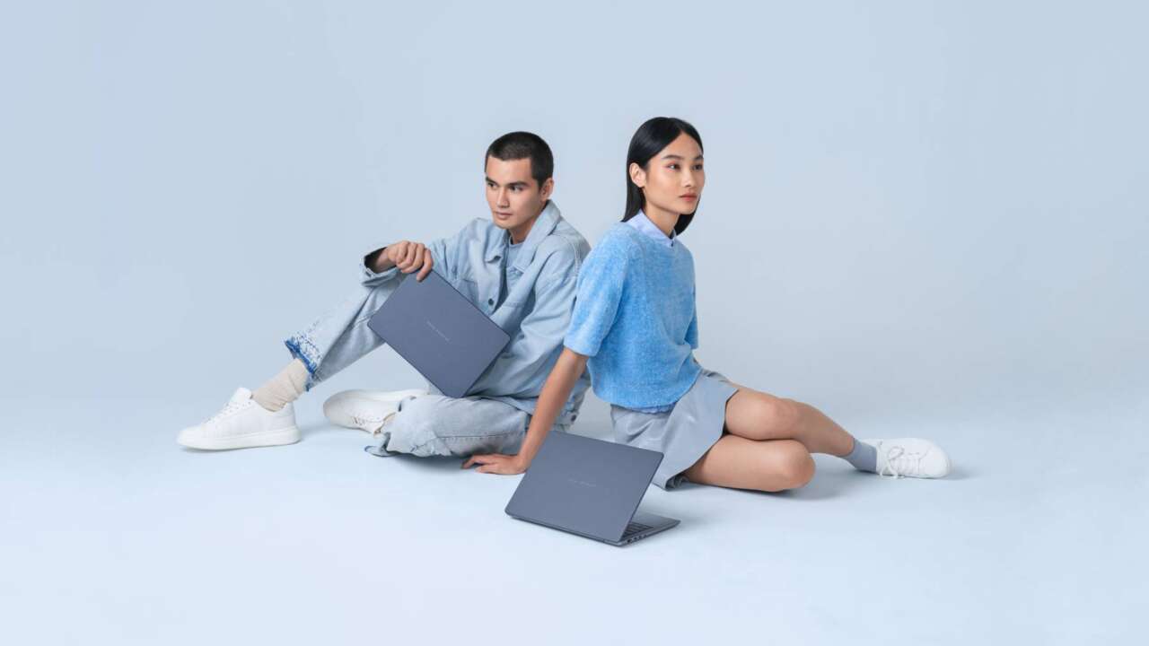 Two ASUS Zenbook 14 laptops in Arctic Blue, shown in an official ASUS press photo