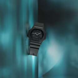 Black Casio G-SHOCK GAC-2500-1A watch against a teal background.