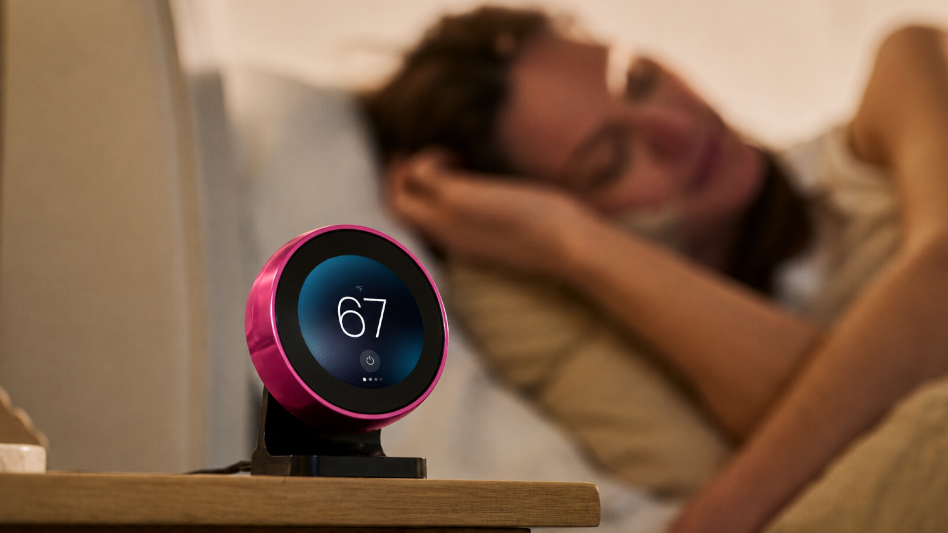 Chilipad 2.0 pink-ring remote beside a bed
