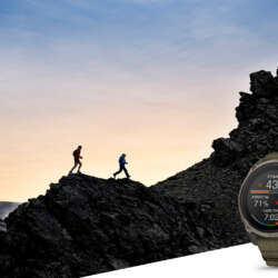 Garmin Enduro 4 with trail runners in a rocky landscape